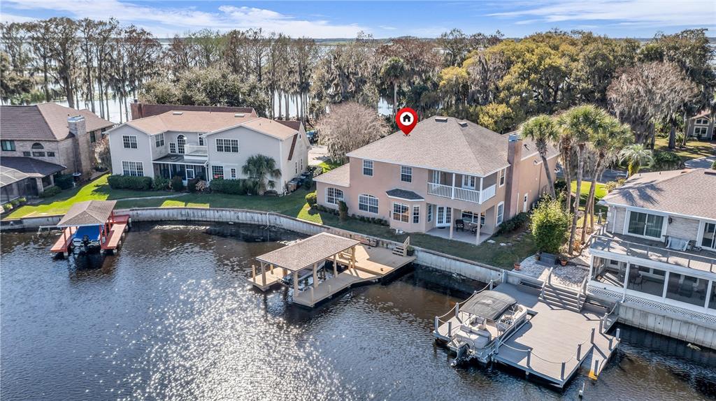 1425 Riviera Drive Kissimmee, FL 34744 - Photo 70 of 82 a aerial view of a house with a swimming pool patio and a yard