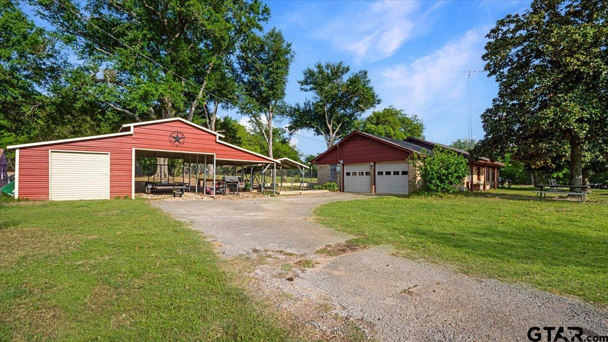8192 County Road 428 Tyler, TX 75704 - Photo 32 of 38 a view of house with outdoor space and yard