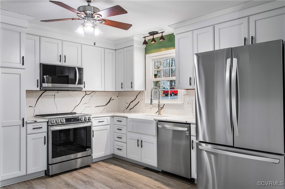 1325 Unison Drive Midlothian, VA 23113 - Photo 11 of 32 a kitchen with cabinets stainless steel appliances and a window