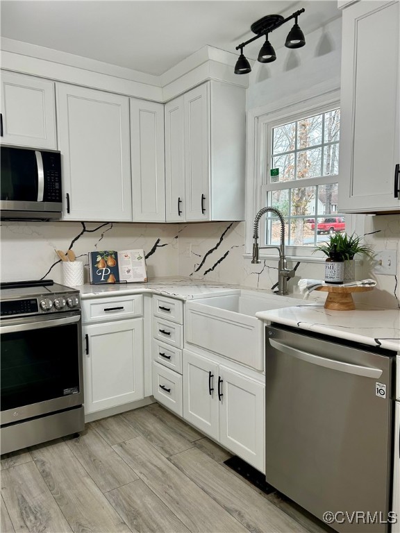 1325 Unison Drive Midlothian, VA 23113 - Photo 12 of 32 a kitchen with cabinets appliances a sink and a window