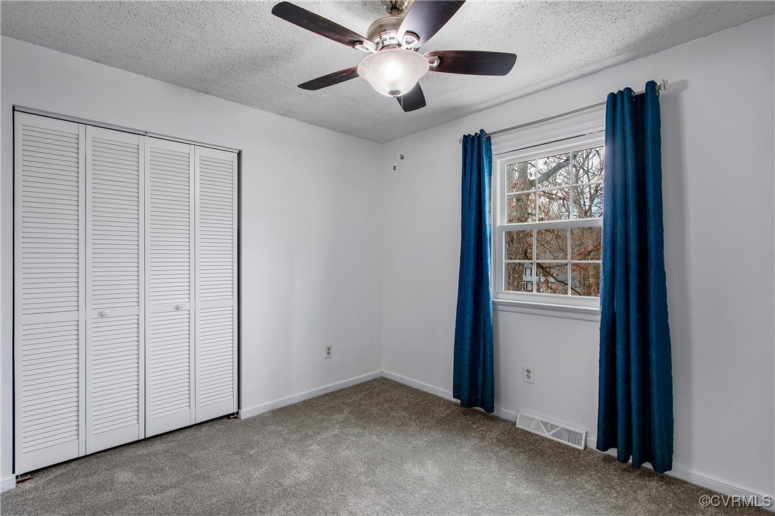 1325 Unison Drive Midlothian, VA 23113 - Photo 27 of 32 an empty room with windows and fan