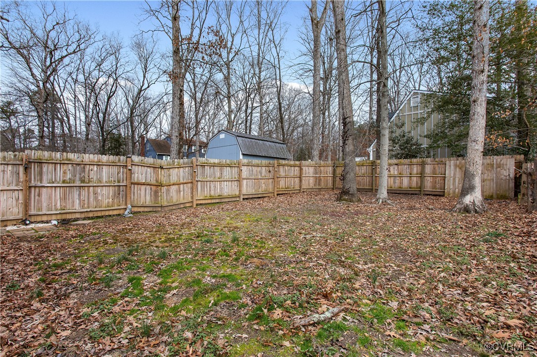 1325 Unison Drive Midlothian, VA 23113 - Photo 29 of 32 a view of backyard with wooden fence