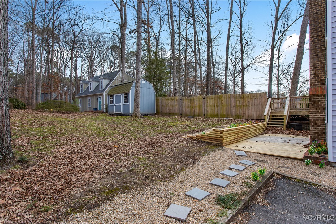 1325 Unison Drive Midlothian, VA 23113 - Photo 30 of 32 a view of a backyard with large trees