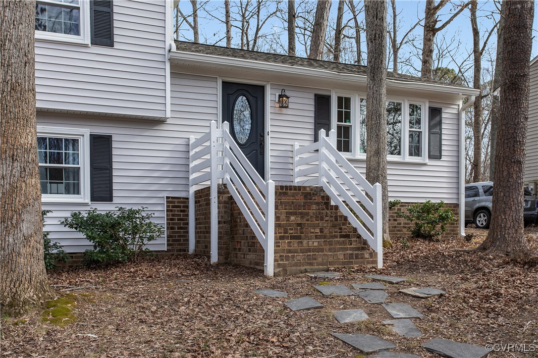 1325 Unison Drive Midlothian, VA 23113 - Photo 3 of 32 a front view of a house with stairs