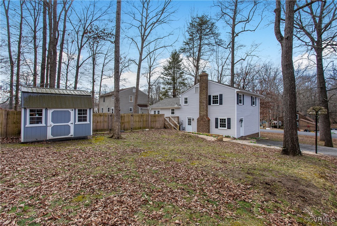 1325 Unison Drive Midlothian, VA 23113 - Photo 32 of 32 a view of a house with a yard and garage
