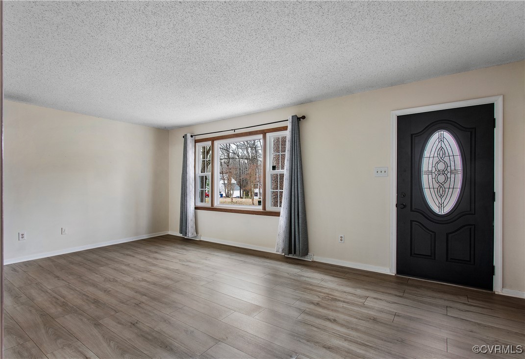 1325 Unison Drive Midlothian, VA 23113 - Photo 5 of 32 an empty room with wooden floor and a window