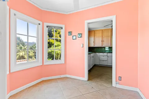 a view of a hallway and a livingroom with furniture