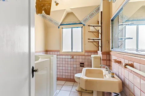 a bathroom with a sink a mirror and a shower