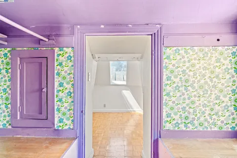 a view of an empty room with windows