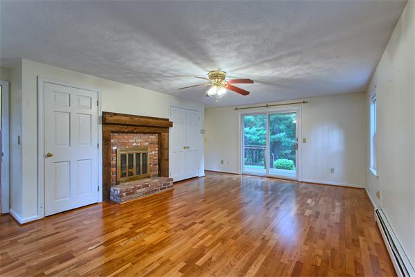 31 Bayberry Road Groton, MA 01450 - Photo 11 of 15 wooden floor in an empty room with a window