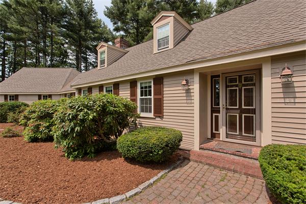 31 Bayberry Road Groton, MA 01450 - Photo 2 of 15 a front view of a house with garden