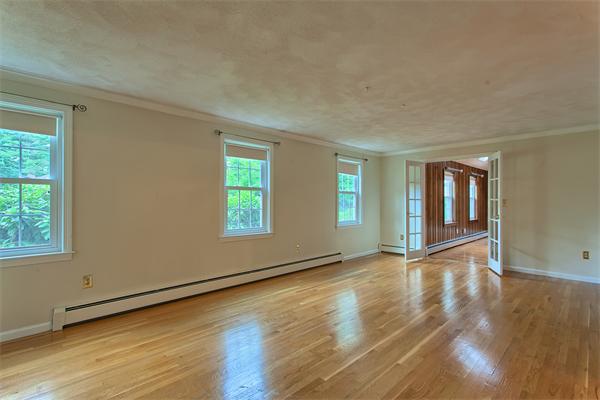 31 Bayberry Road Groton, MA 01450 - Photo 9 of 15 a view of an empty room with wooden floor and a window