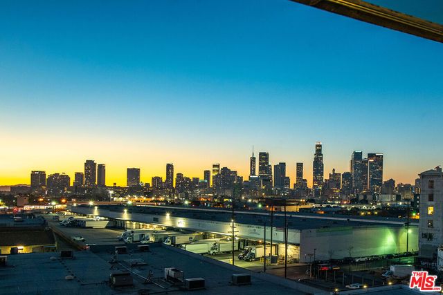a living room with lots of furniture and a chandelier