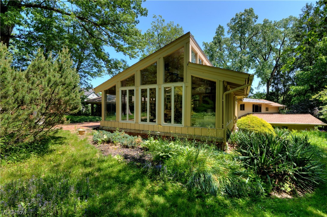 3222 Kersdale Road Pepper Pike, OH 44124 - Photo 34 of 35 This home also has a 2 car heated and cooled attached garage and attached temp controlled greenhouse. Fabulous backyard with two brick paver patios overlook the lush, landscaped grounds.