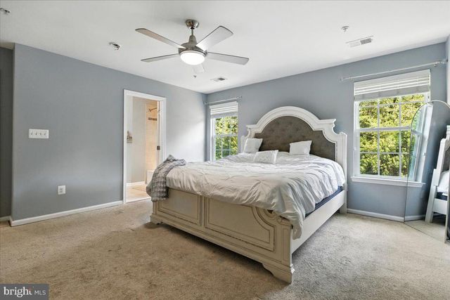 a view of a hallway with storage and utility