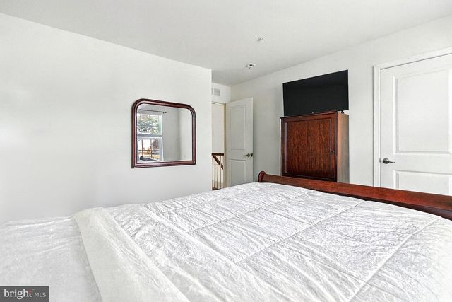a bathroom with a bath tub with a shower
