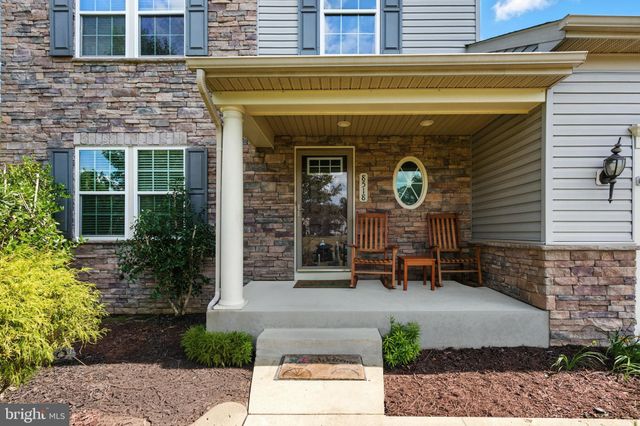 a front view of a building with garden