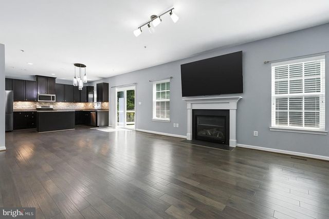 a outdoor living space with patio furniture and a umbrella