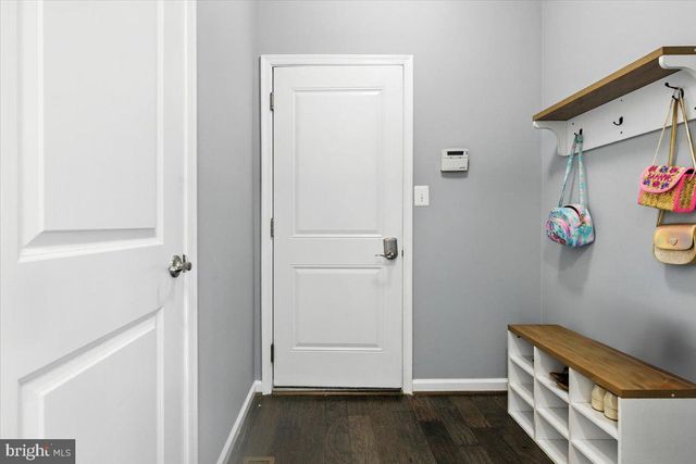 a bathroom with a sink toilet and a mirror
