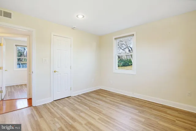 an empty room with a wooden door