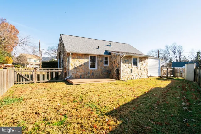 a view of a house with a snow in the background