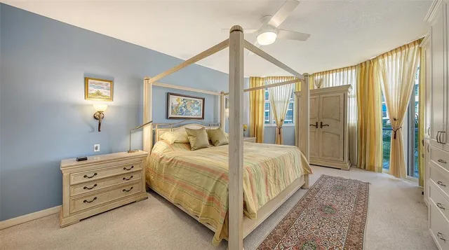 a bedroom with a bed and a mirror