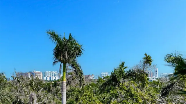 a view of a white building with a large windows