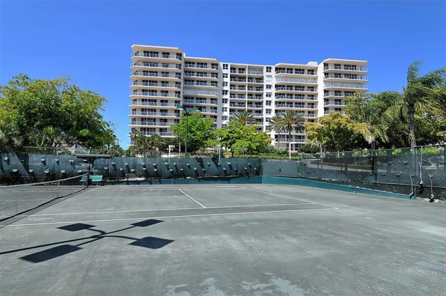 a view of a swimming pool with a table and chairs