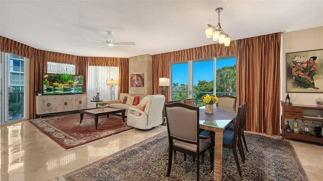 a living room with fireplace furniture and a window