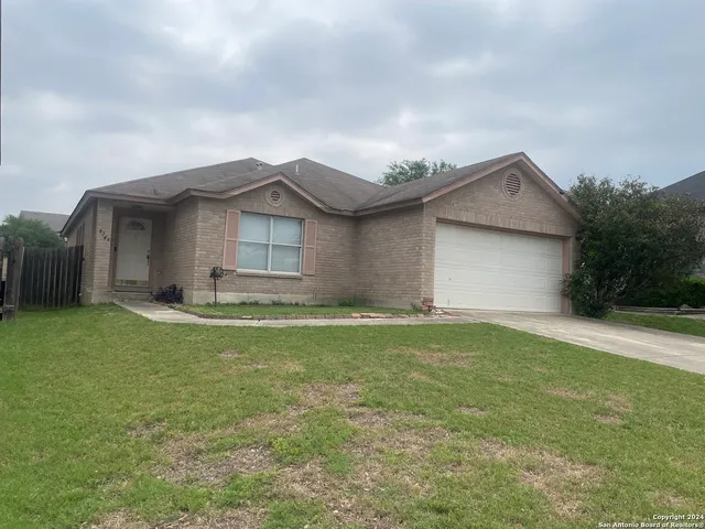 a house view with a garden space