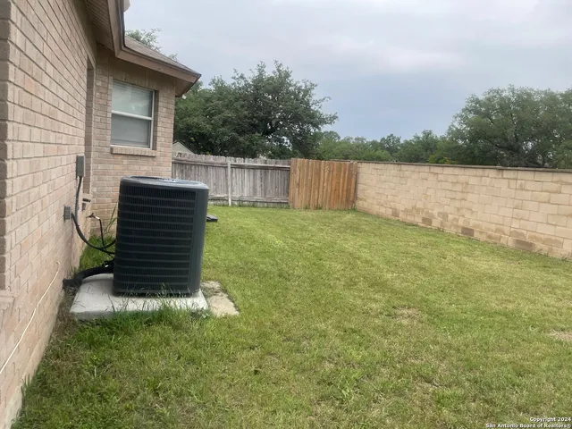 a backyard of a house with lots of green space