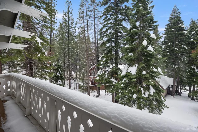 a view of a balcony with a tree