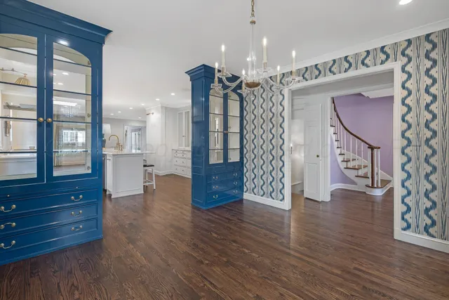 a room with a dresser and a window