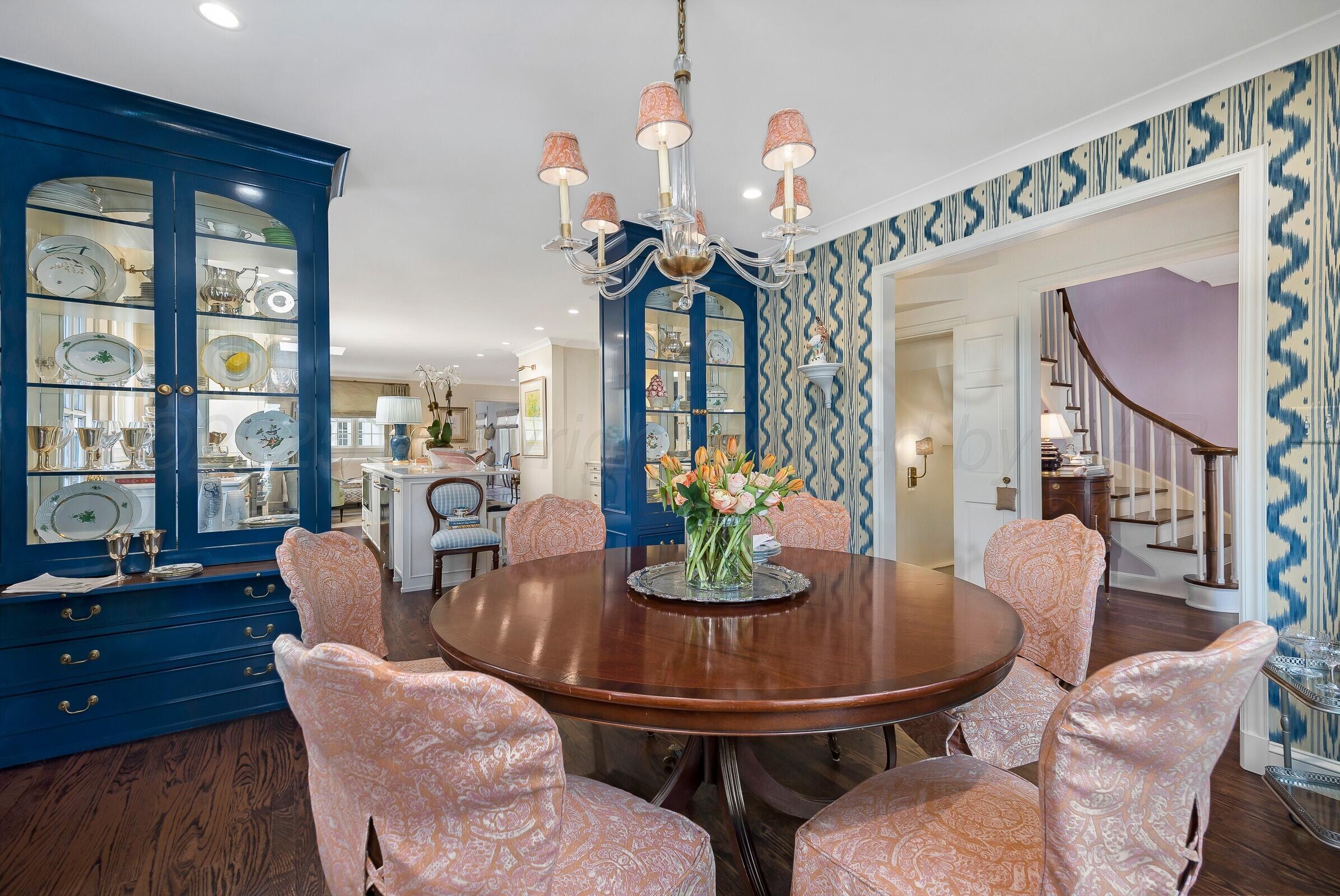 3003 South Hughes Street Amarillo, TX 79109 - Photo 14 of 76 a dining room with furniture a chandelier and wooden floor