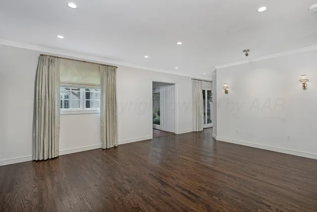 a view of storage and utility room with wooden floor
