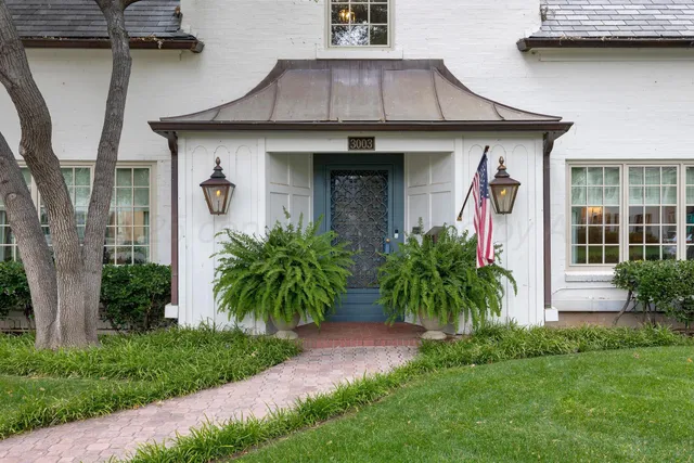 a front view of house with yard and outdoor seating