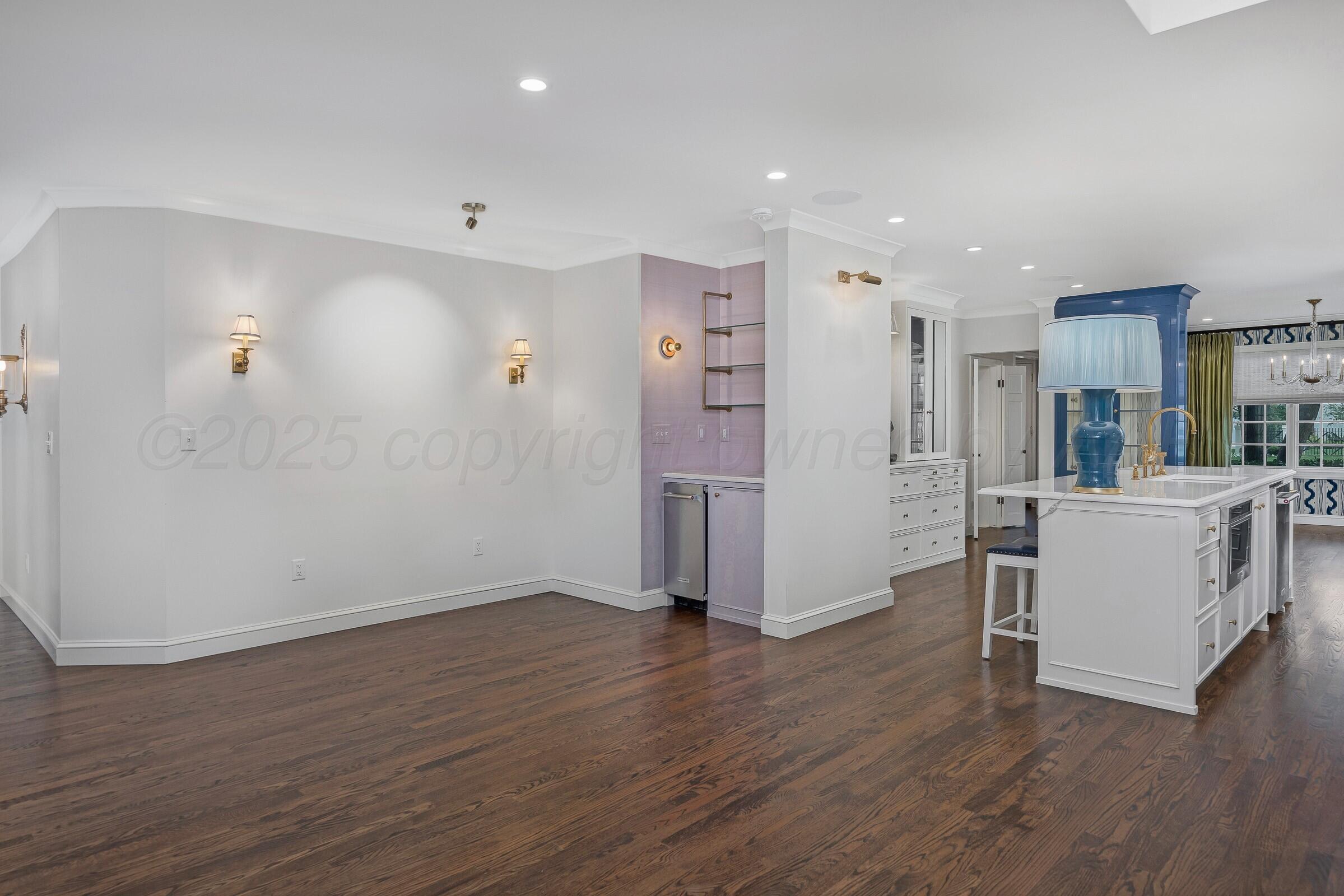 3003 South Hughes Street Amarillo, TX 79109 - Photo 21 of 76 a view of kitchen with furniture and wooden floor