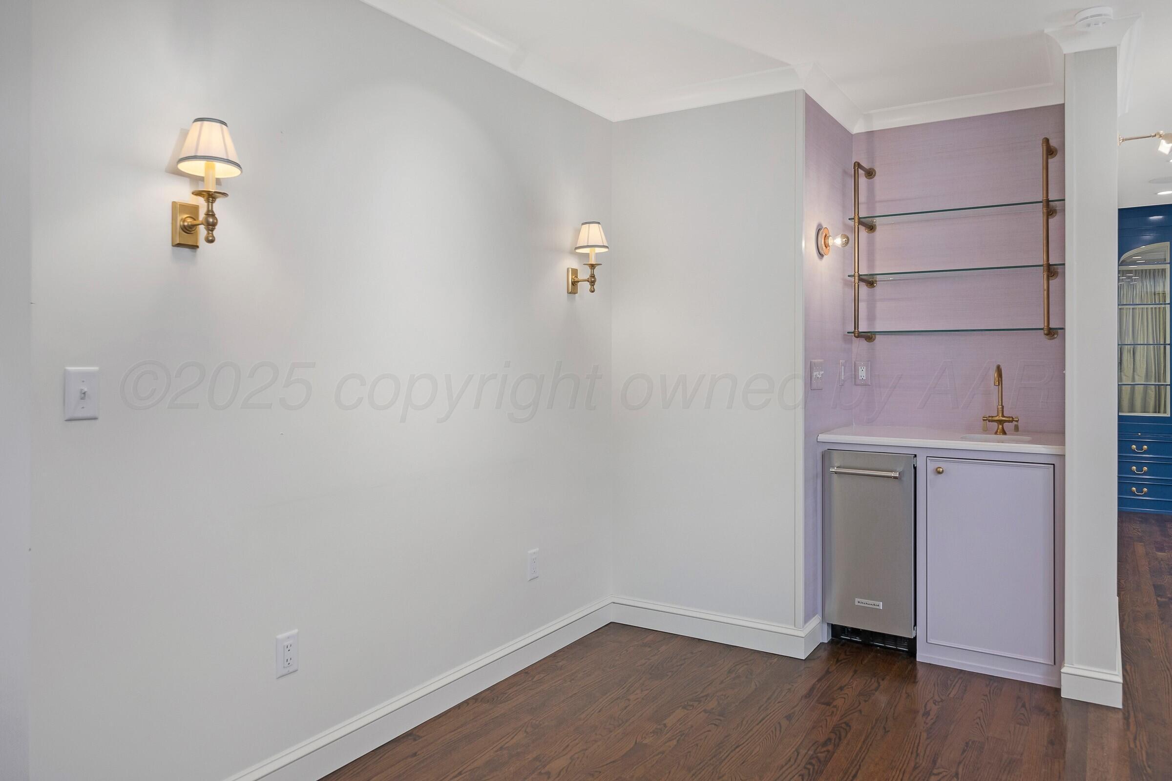 3003 South Hughes Street Amarillo, TX 79109 - Photo 22 of 76 a view of storage and utility room with wooden floor