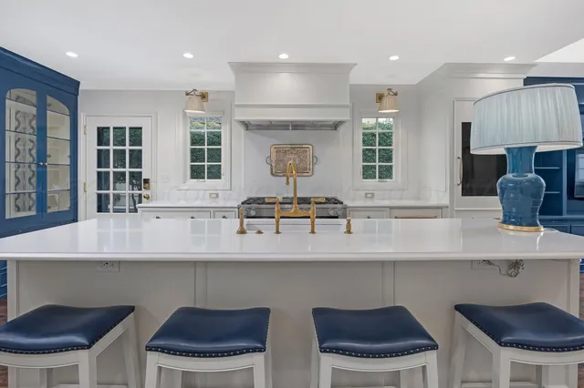 a view of front door with wooden floor and stairs