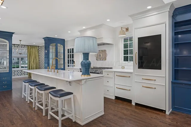 a bathroom with a sink and mirror with toilet