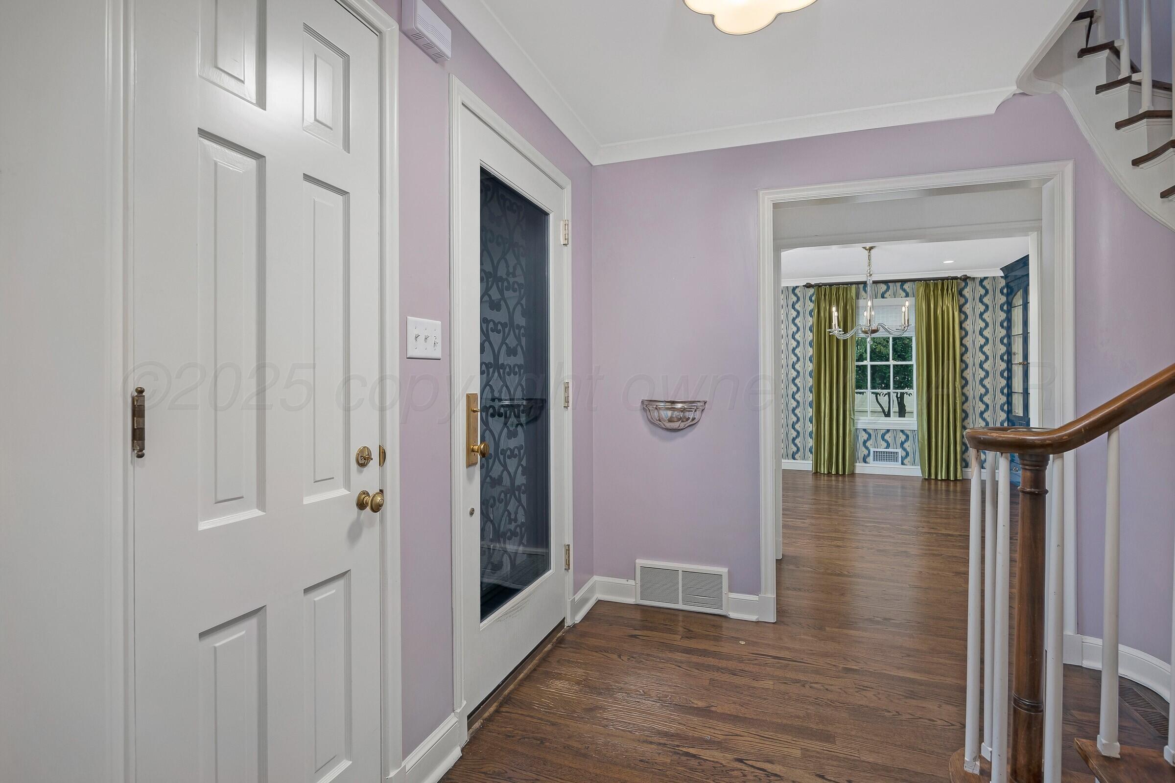 3003 South Hughes Street Amarillo, TX 79109 - Photo 37 of 76 a view of a hallway with wooden floor and entryway