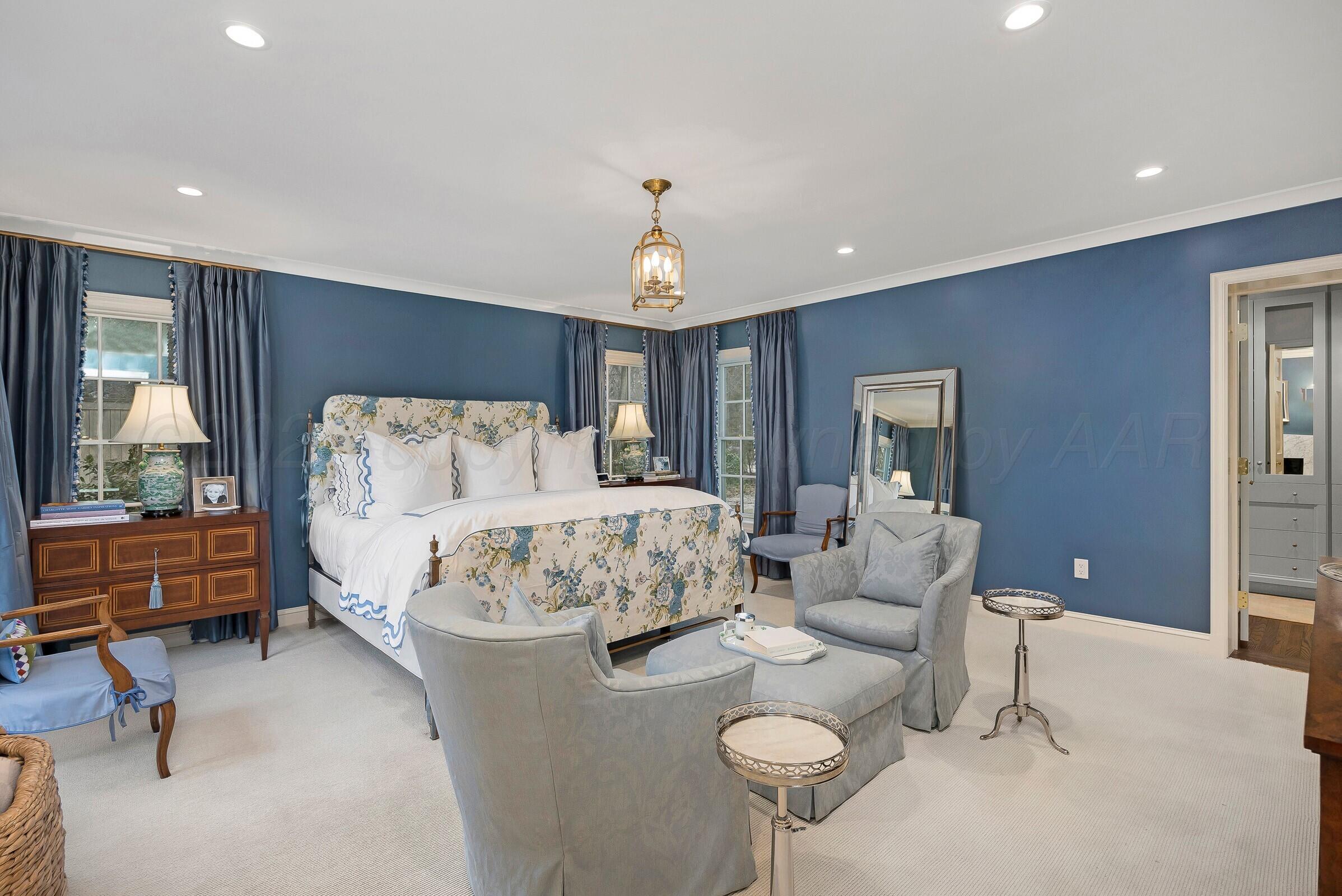 3003 South Hughes Street Amarillo, TX 79109 - Photo 40 of 76 a bed room with furniture and a chandelier