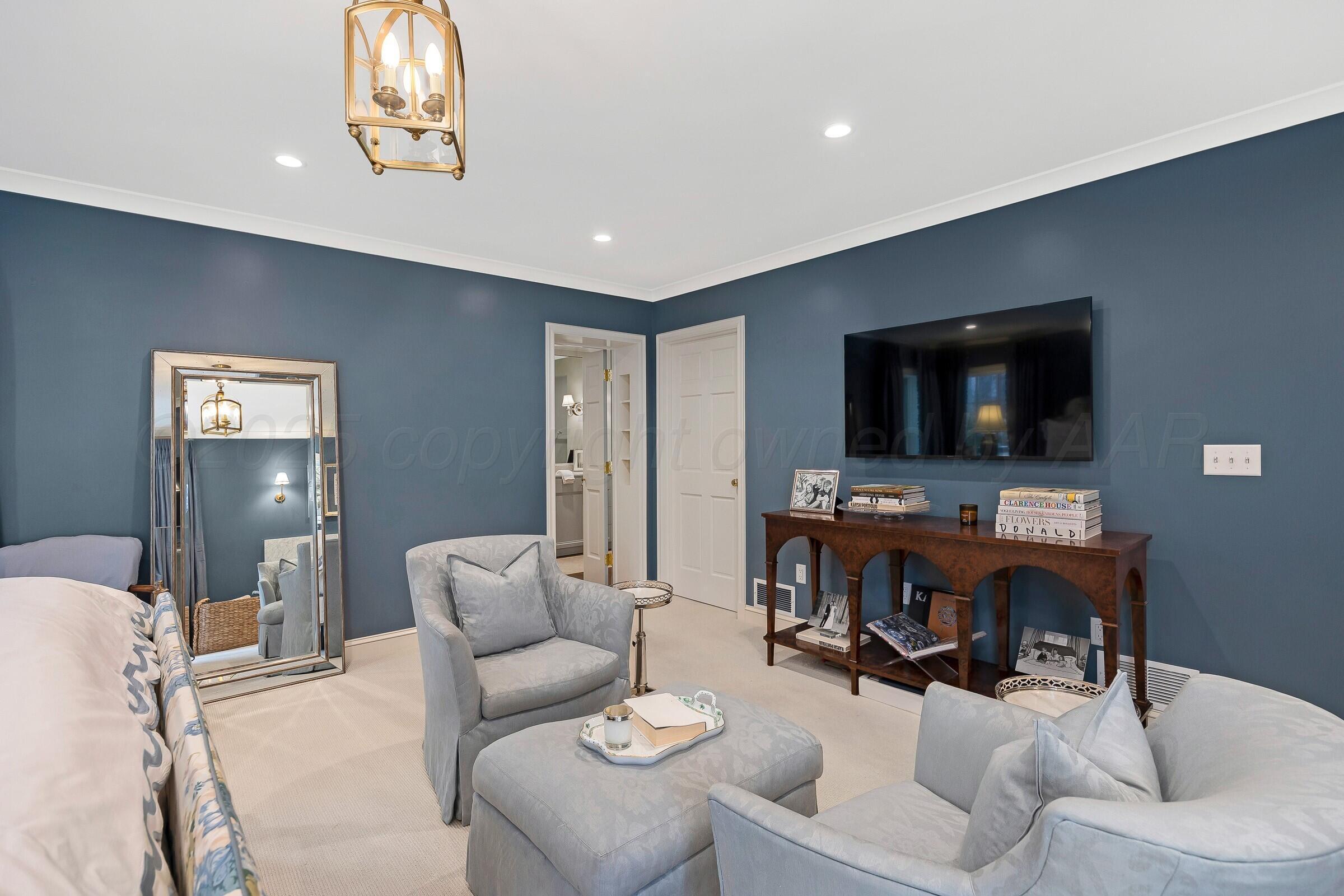 3003 South Hughes Street Amarillo, TX 79109 - Photo 41 of 76 a living room with furniture and a flat screen tv