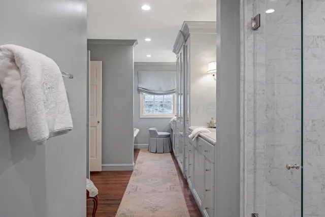a utility room with cabinets washer and dryer
