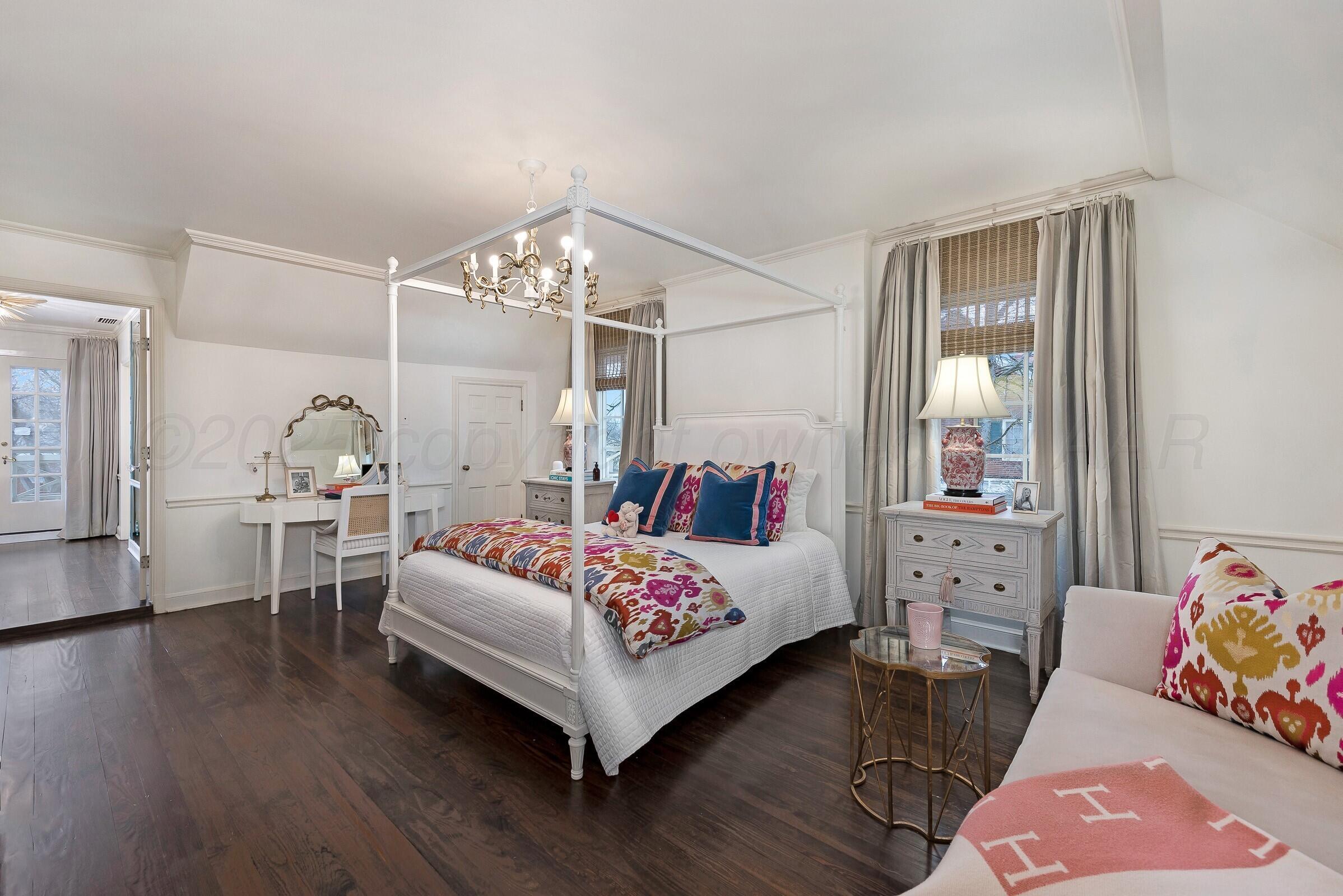 3003 South Hughes Street Amarillo, TX 79109 - Photo 47 of 76 a bedroom with a bed and wooden floor