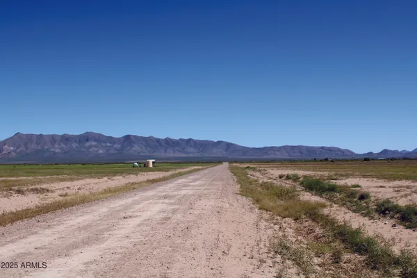 a view of an ocean and a mountain