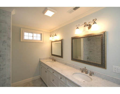 133 Shade Street Lexington, MA 02421 - Photo 11 of 21 a bathroom with a double vanity sink and a mirror