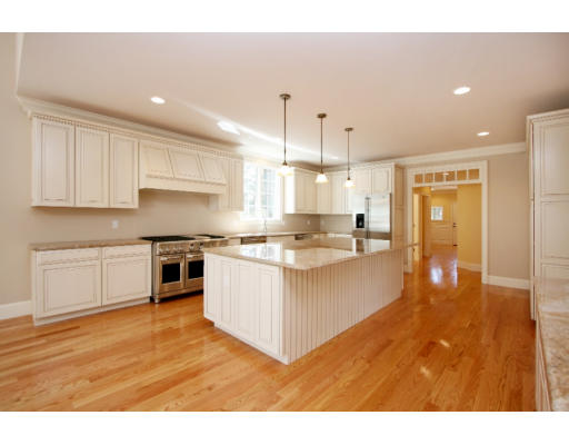 133 Shade Street Lexington, MA 02421 - Photo 4 of 21 a large white kitchen with stainless steel appliances