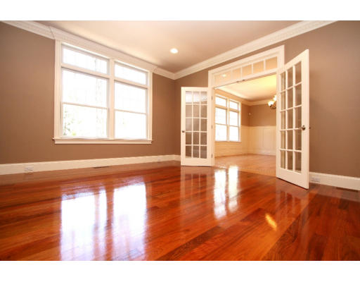 133 Shade Street Lexington, MA 02421 - Photo 6 of 21 a view of an empty room with wooden floor and a window