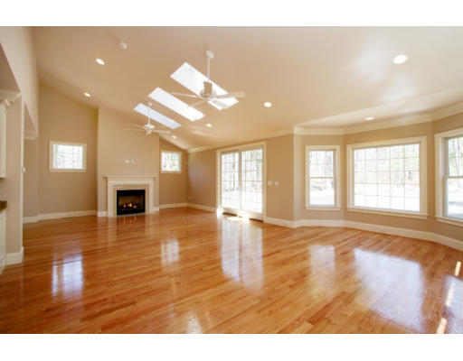 133 Shade Street Lexington, MA 02421 - Photo 7 of 21 a view of an empty room with wooden floor and a window